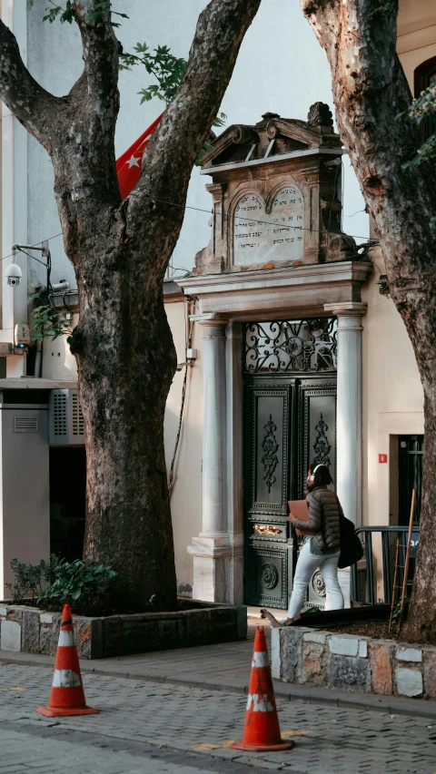 a person is sitting on a bench in the street