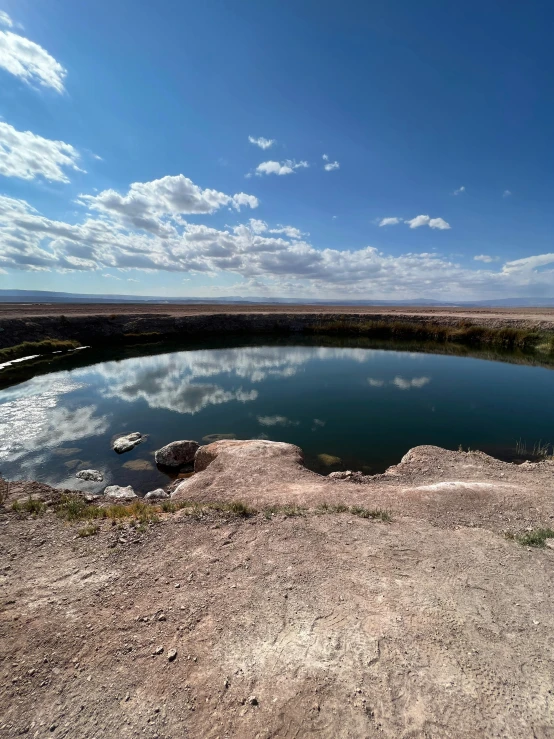 the bright blue sky and the calm lake