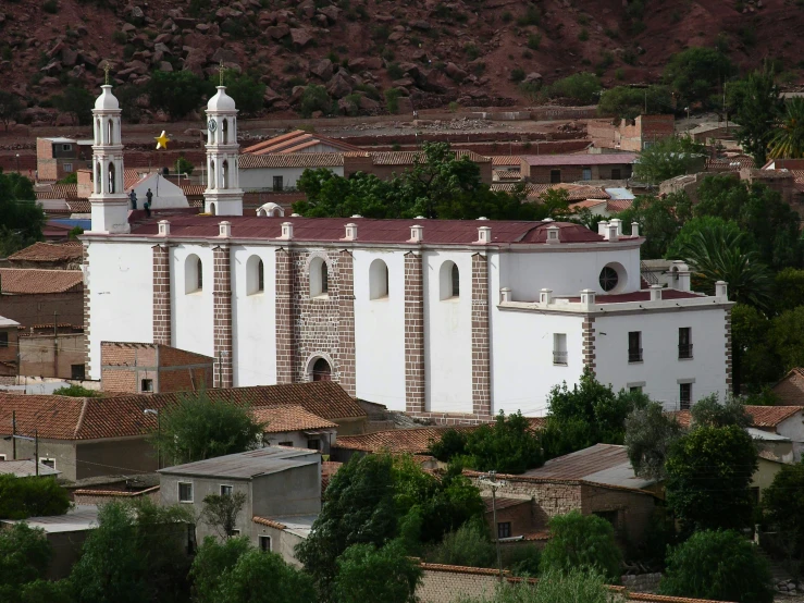 a building with many windows and small bell towers