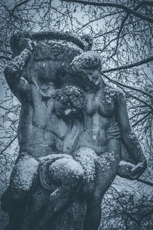 an old statue in the middle of winter