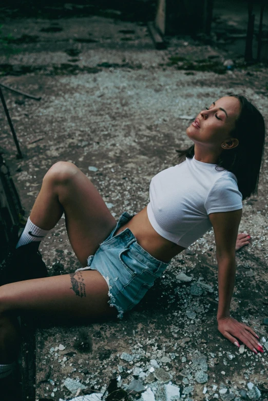 a woman posing for a pograph in the dirt