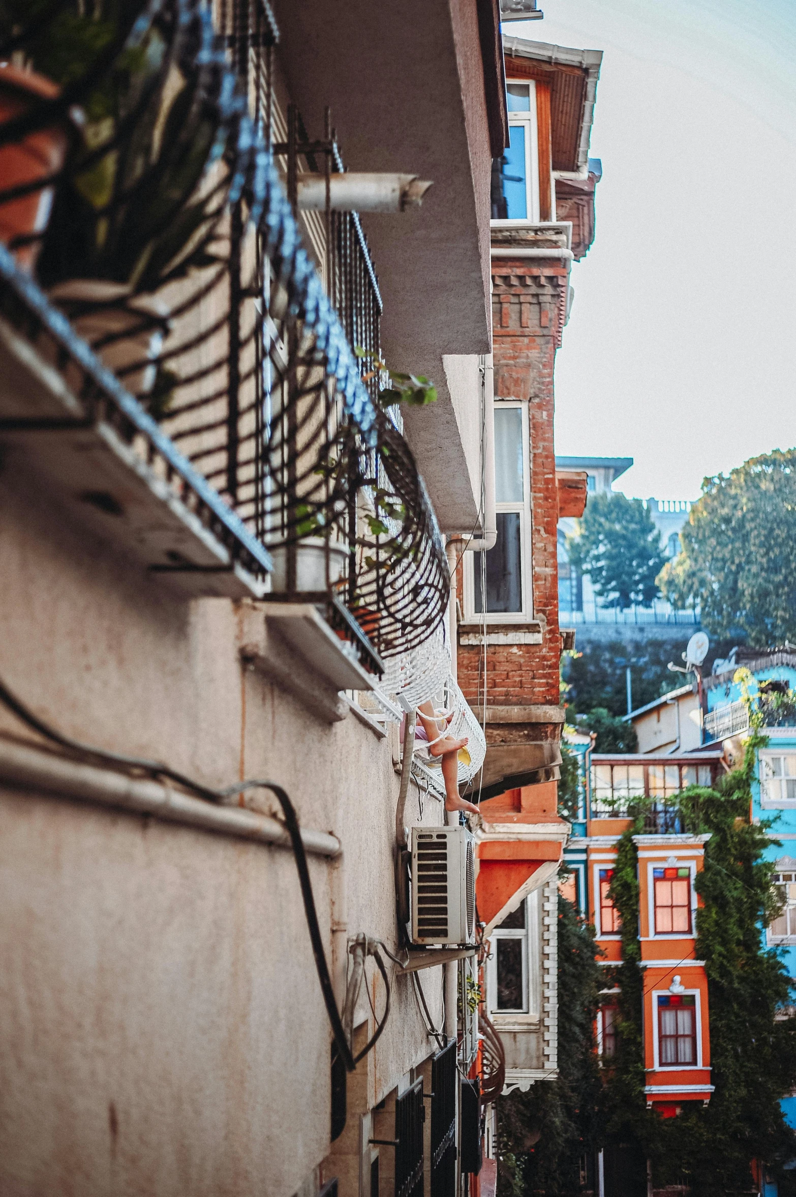 the city has many multi colored buildings on the sides of it