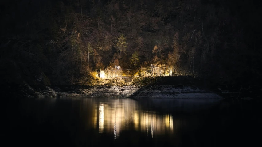 a boat is parked by some dark woods