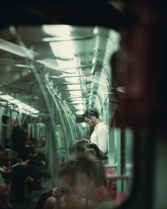 an image of man riding a commuter train