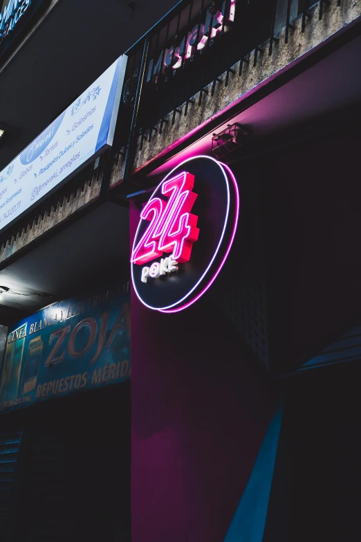 this neon sign above the entrance to a restaurant