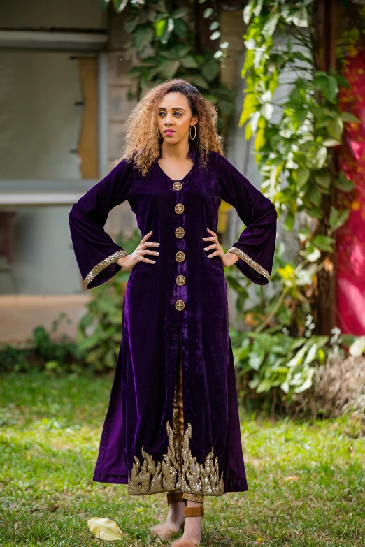 a woman in a purple dress and yellow shoes