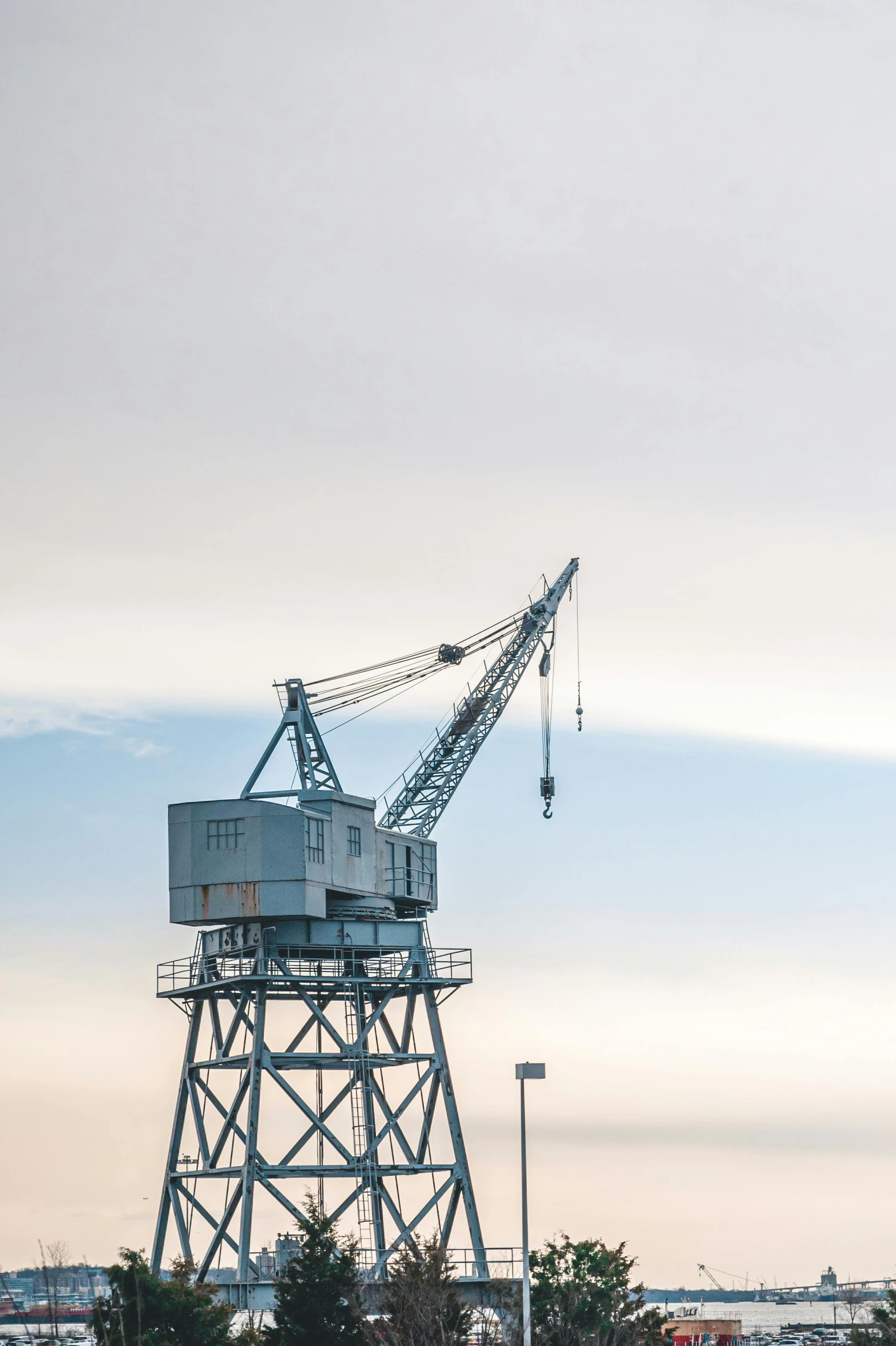 a building and tower with cranes on it