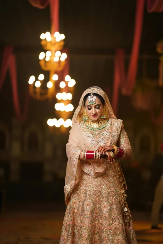 a bride is dressed in traditional indian garb