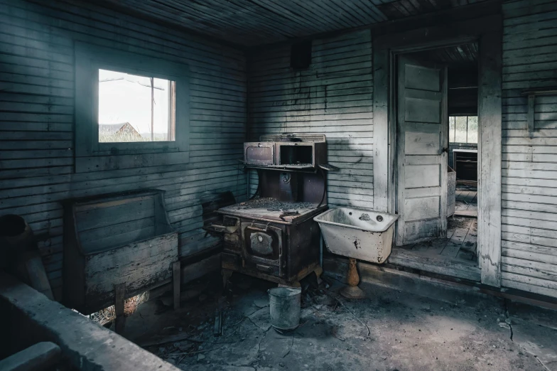 a dilapidated kitchen in an old building with a broken cabinet