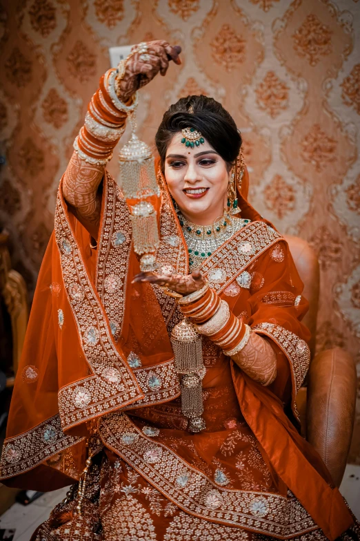 a beautiful indian bride in her traditional red wedding outfit