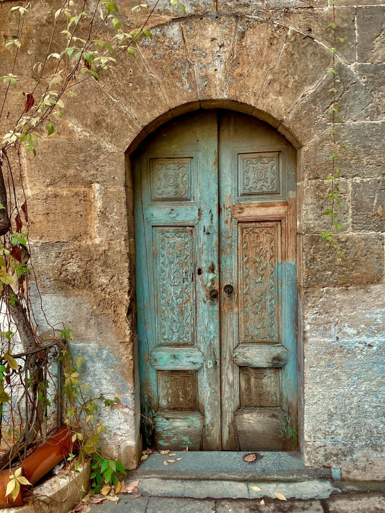 a very old looking doorway and wall in a building