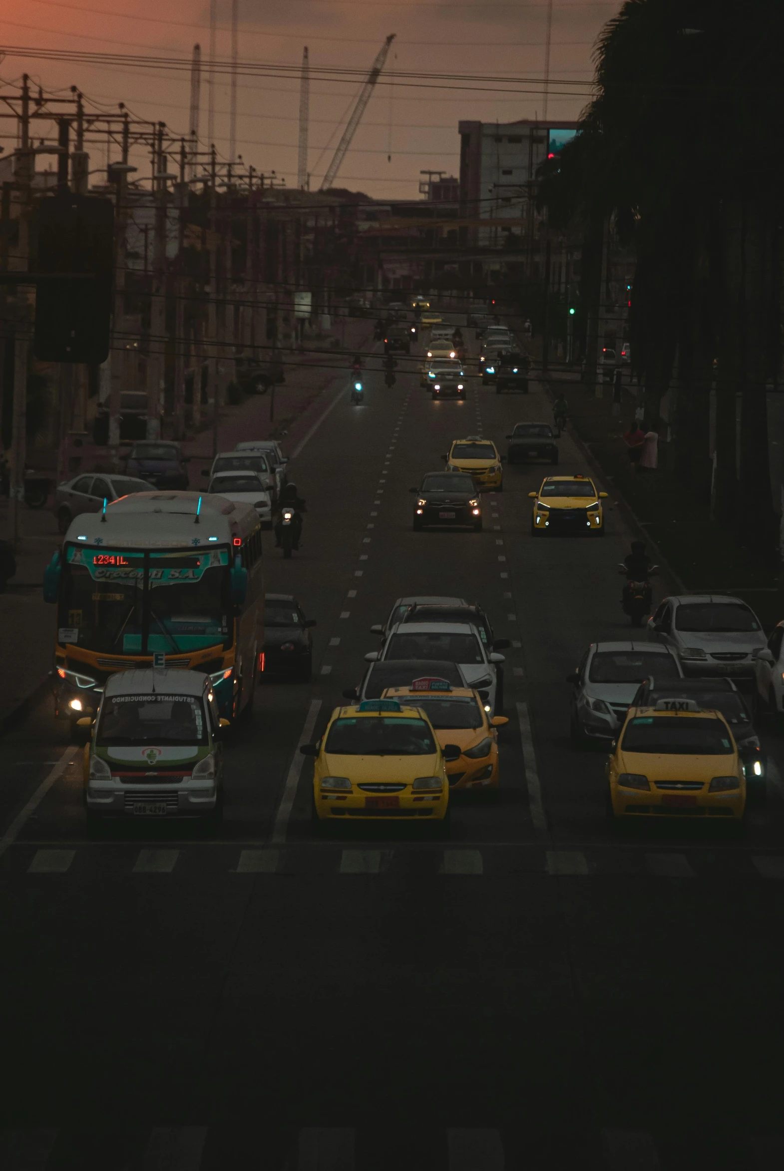 a street scene at night with lots of traffic