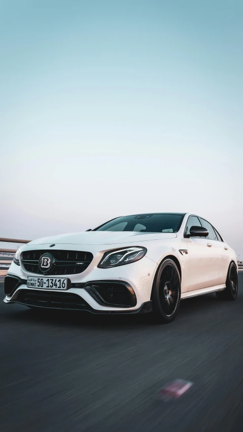 a mercedes s - class driving down a highway