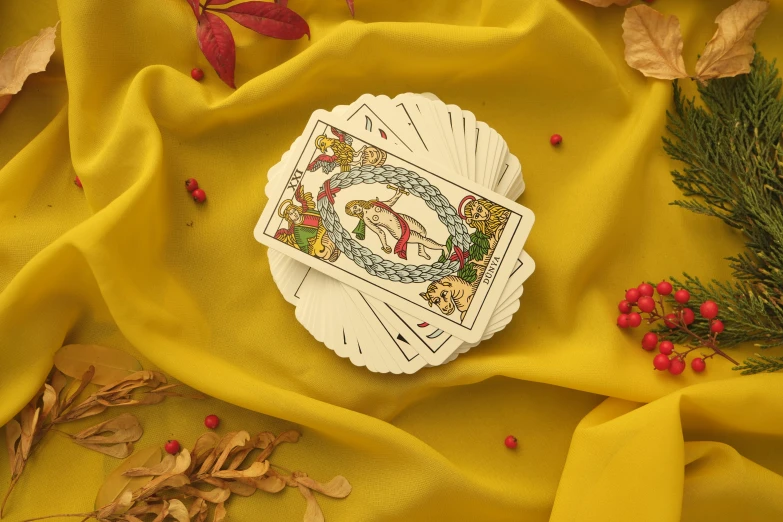 a yellow cloth with two cards in the center