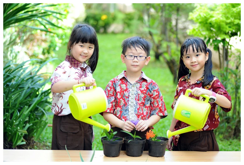 the three s are holding pots with flowers