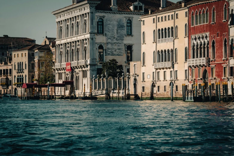 a row of very pretty looking buildings by the water