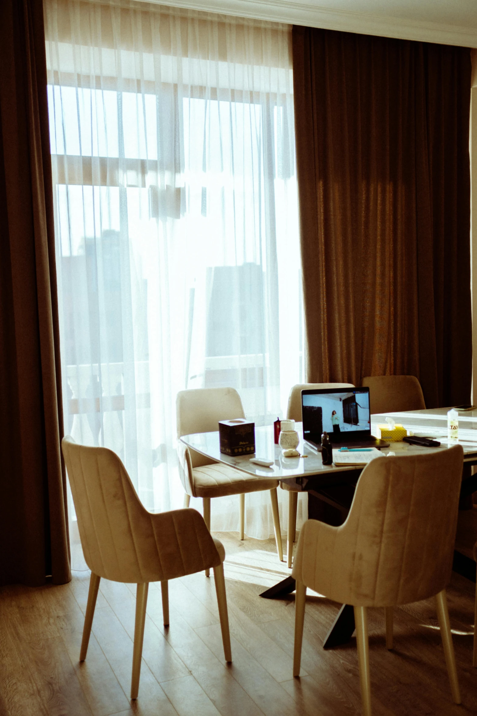 an empty room with several chairs in front of a window