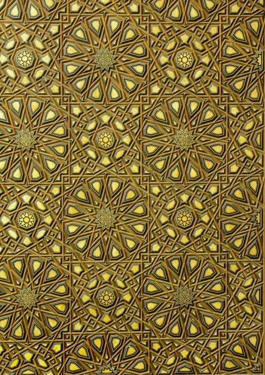 an intricate gold design with small diamonds on a black and white background
