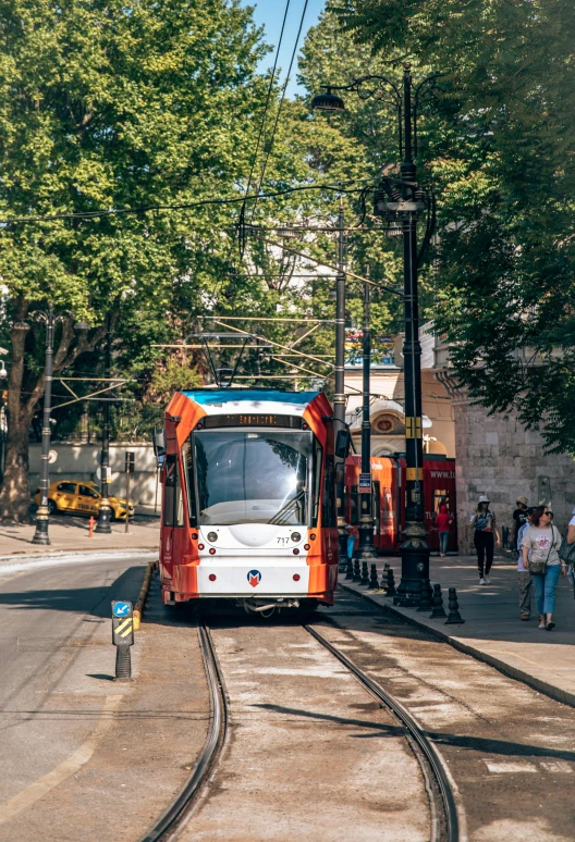 a trolley is at the station waiting for passengers to board