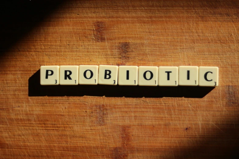 a scrabble of word on wood that reads probiotic