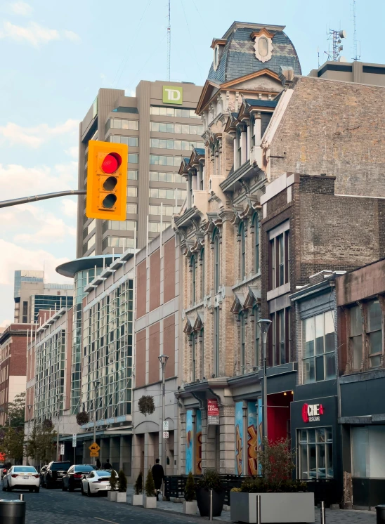 a tall brick building sitting next to a traffic light