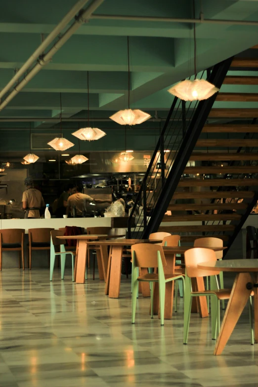 a few chairs at a table that are in a restaurant