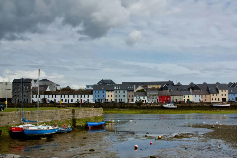 some buildings are in the background and water in the foreground