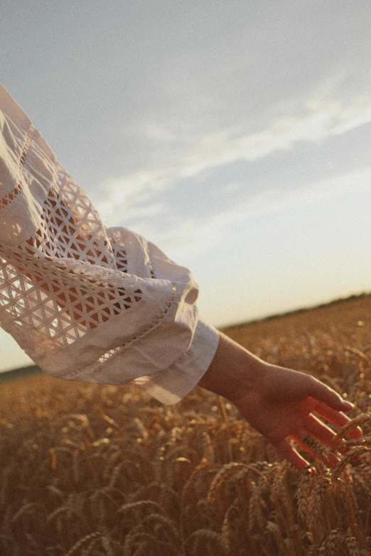 a woman with her hands in the grass