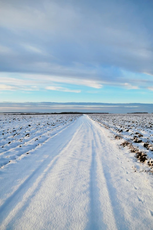 a long road that is covered with snow