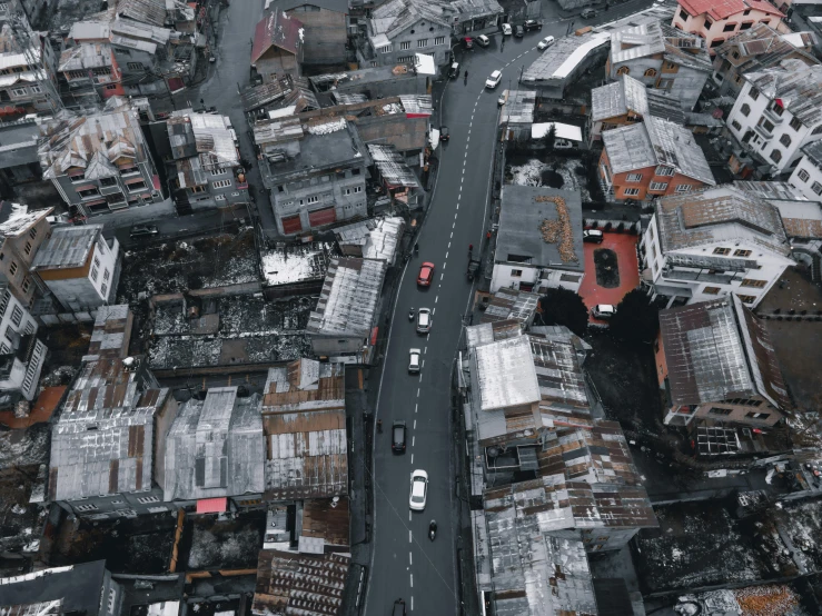 a city street that is partially completely covered with snow