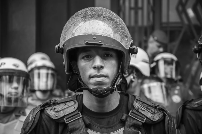 black and white pograph of  wearing leather helmets