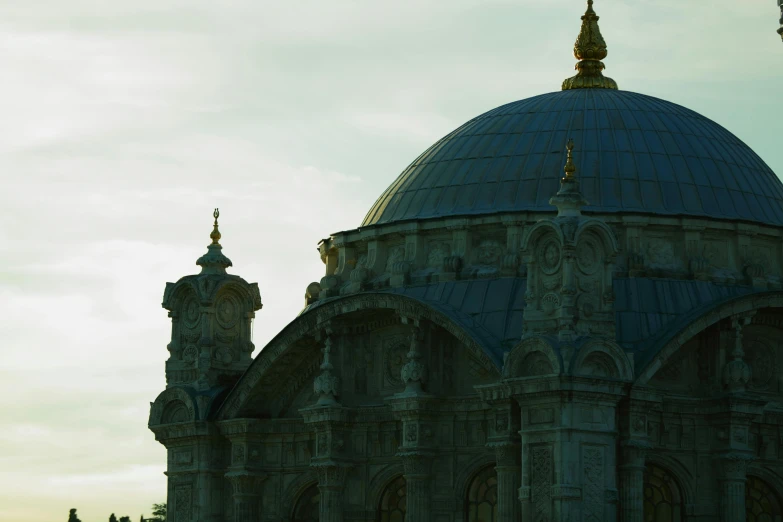 two very tall buildings with a dome on top