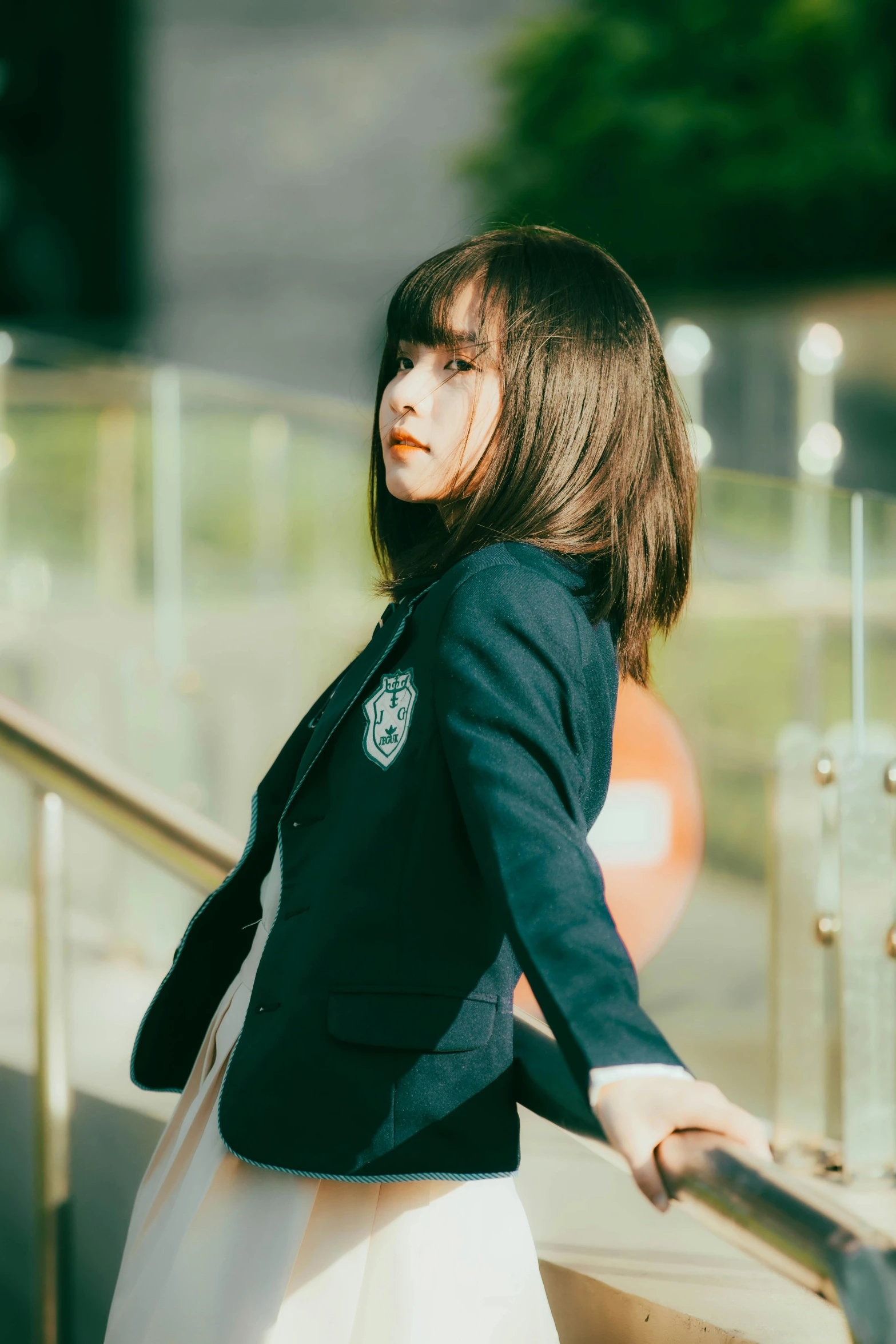 a woman is walking down some stairs wearing a suit