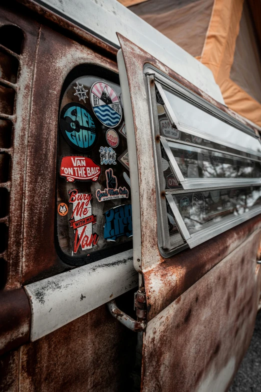 the front end of a van is covered in stickers