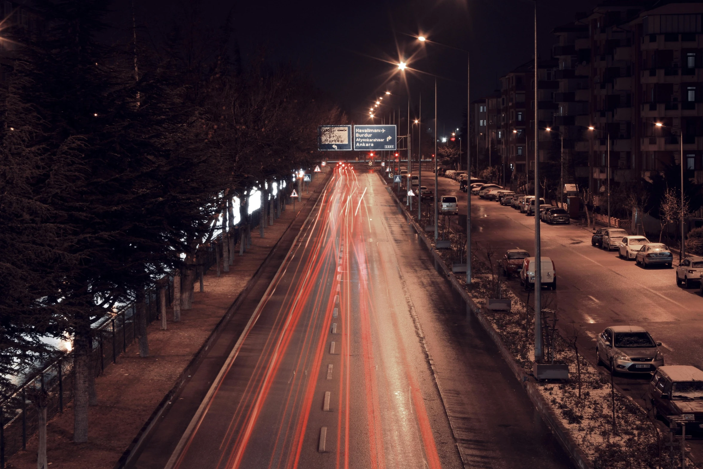 the lights of cars are on the city street