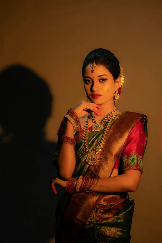 a woman in a colorful blouse posing for the camera