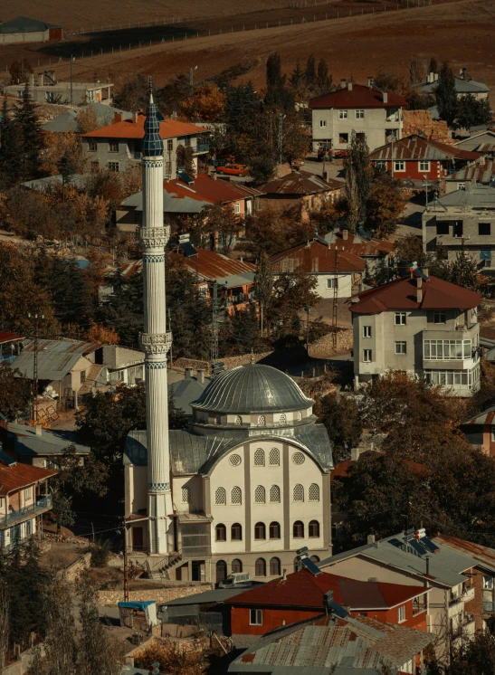 an aerial view of the city with a very tall tower