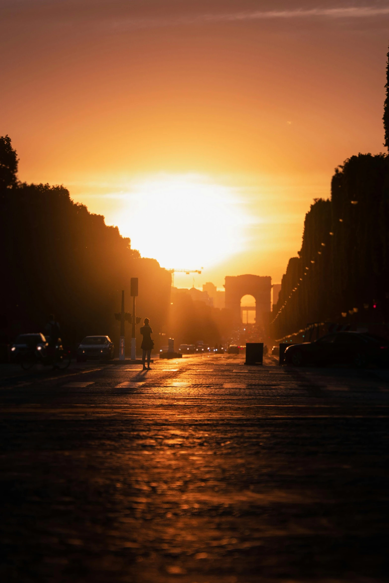 a po of the sun setting over some buildings