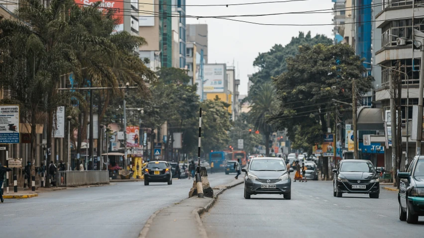 the busy street in front of the buildings is empty