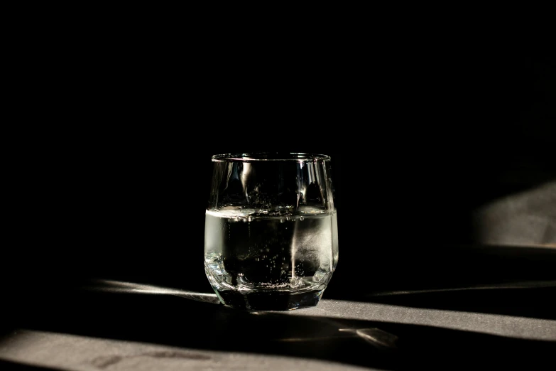 a black and white po of a glass on the table