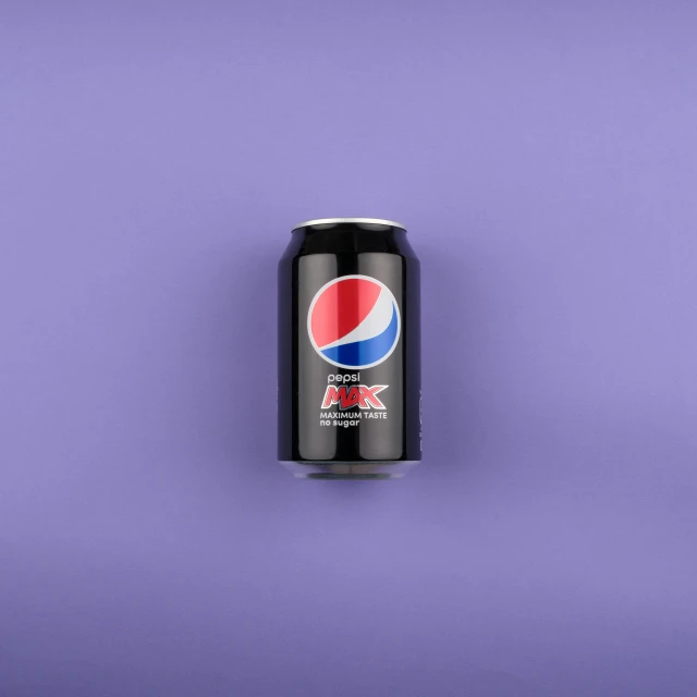 a can of soda on a purple background