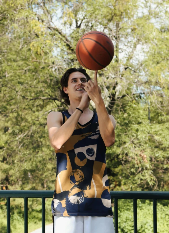 a man holding a basketball in the air