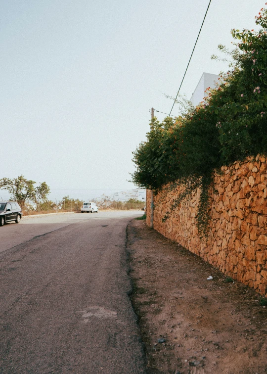 a black car on the side of a road