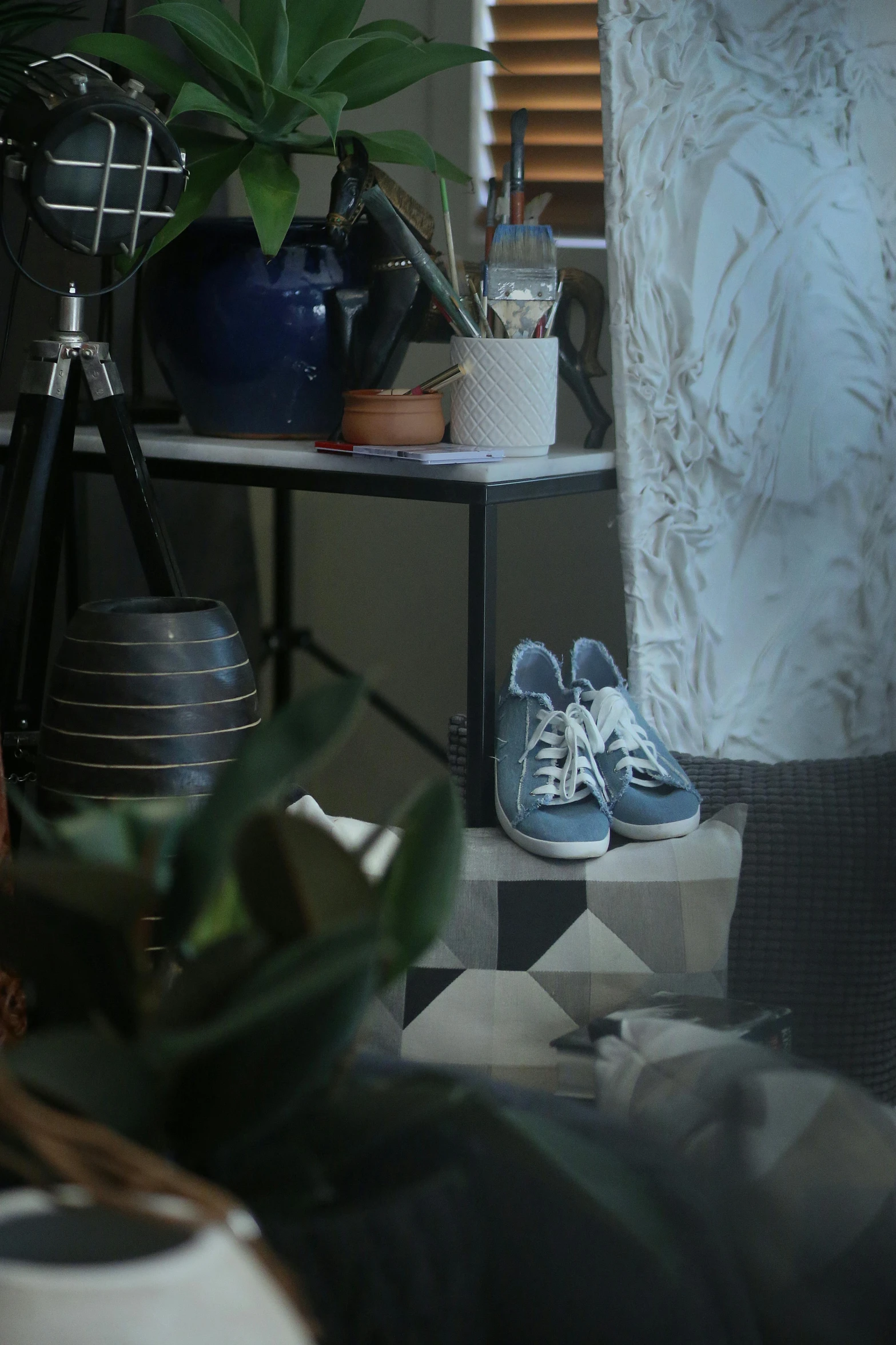 shoes and accessories on the corner of a room