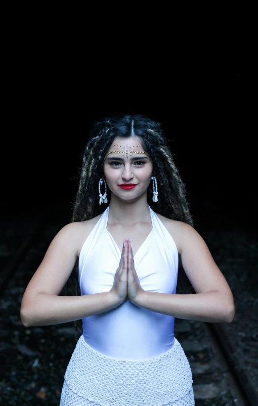 a young woman sitting in a yoga pose