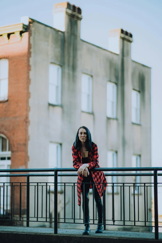 woman with blue shoes on stairs near buildings