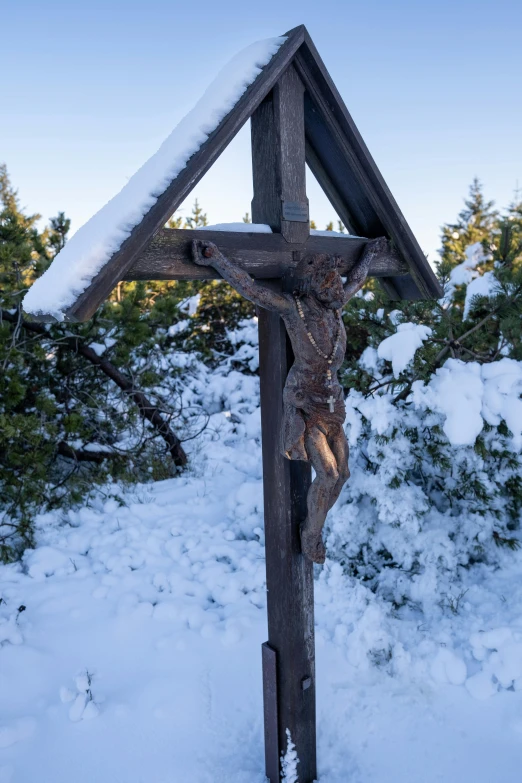 the cross is adorned with a vine on top