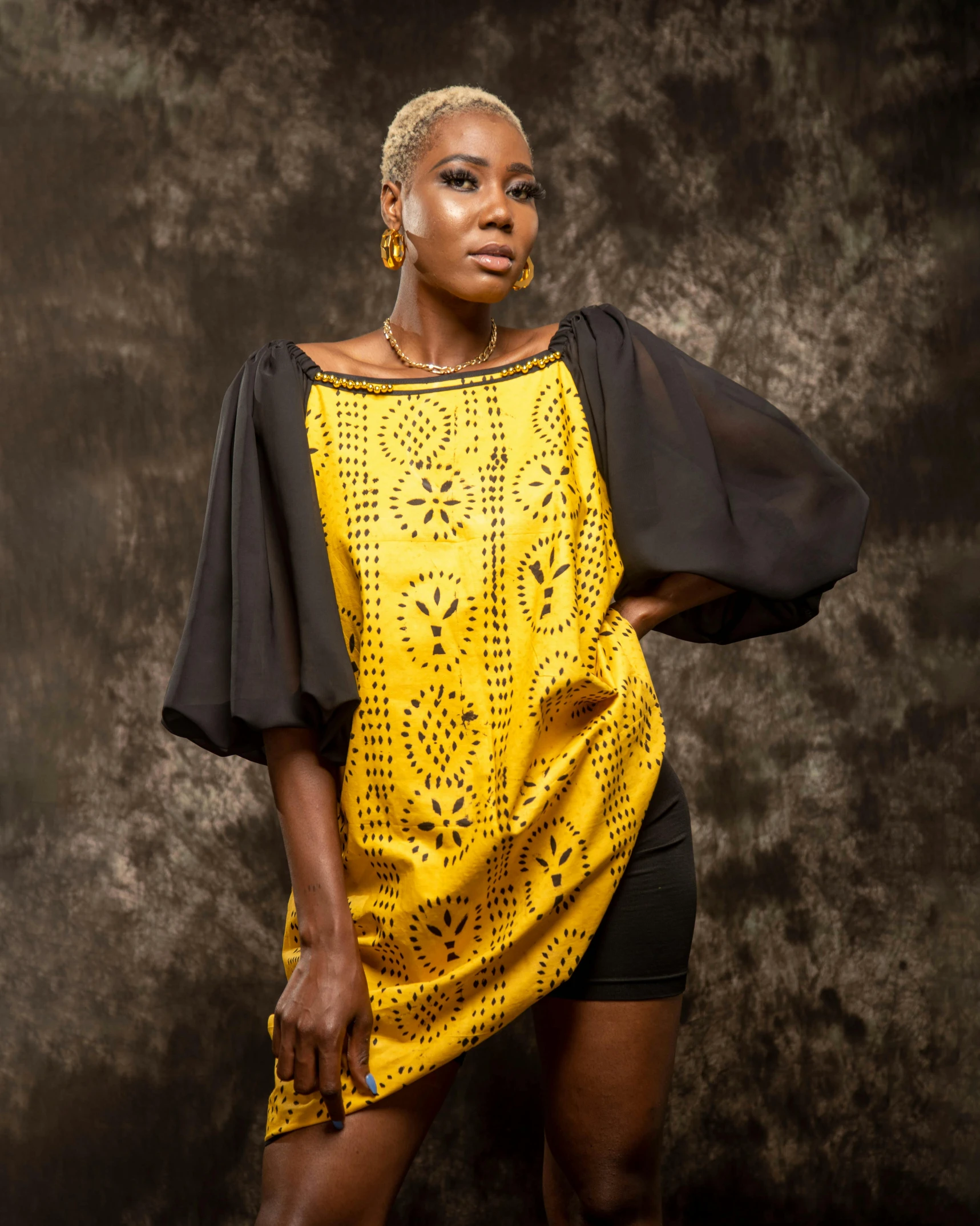 a woman posing with her hair styled with african american hair