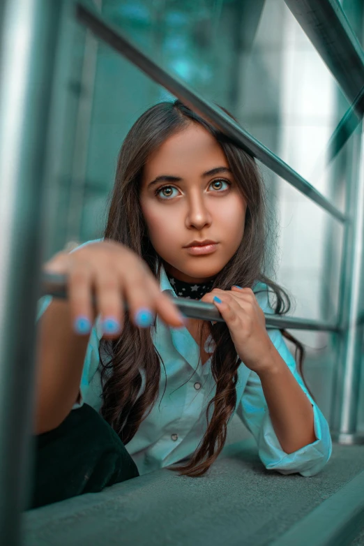 woman sitting on the edge of an elevator