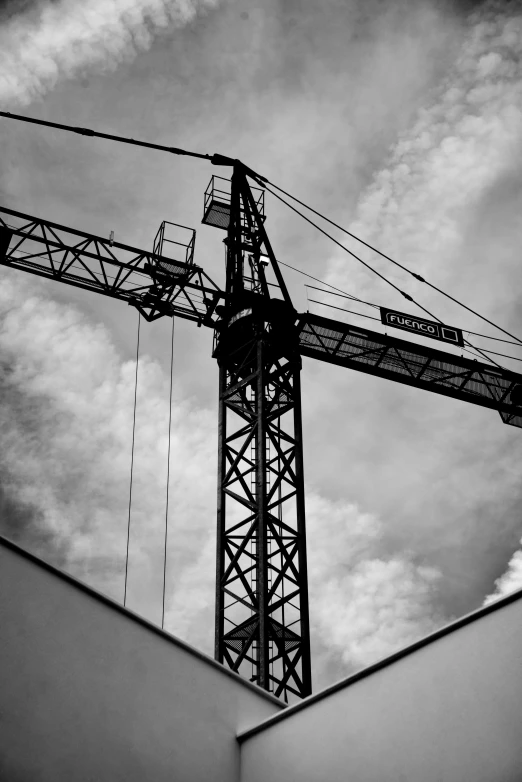 a large crane that is standing on the side of a building